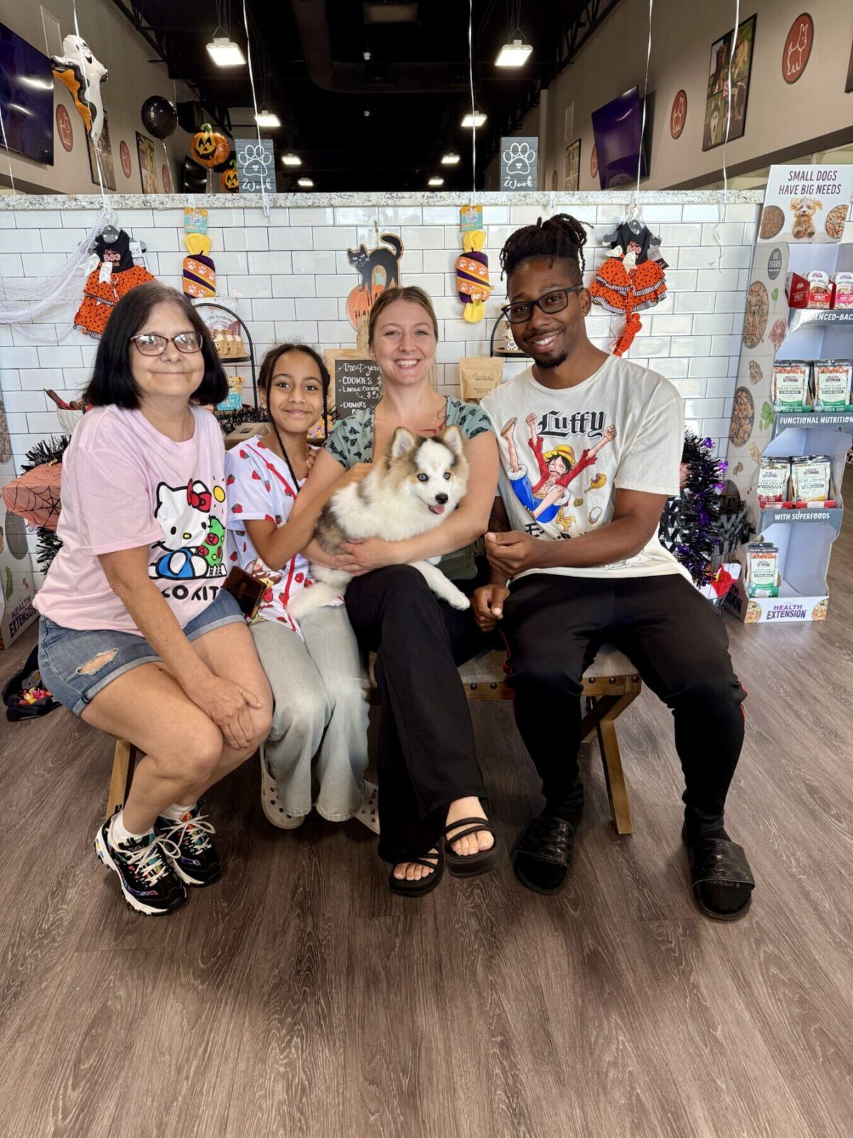 A family welcoming a puppy at Petland Woodlands